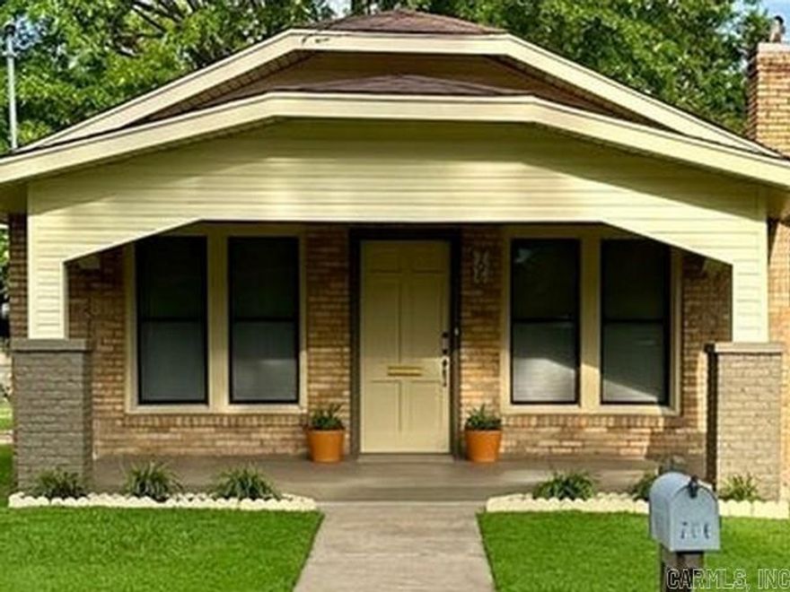 Fall in love and awe with this nearly century-old charmer in historic district that has been lovingly restored with equal attention given to both preservation of its history and modernization to meet today's conveniences. In addition to the original Quarter Sawn White Oak floors, all original solid wood interior doors with their brass and glass knobs remain intact. Original door and window casing/trim and baseboards have also been preserved. Storage building in fenced back yard