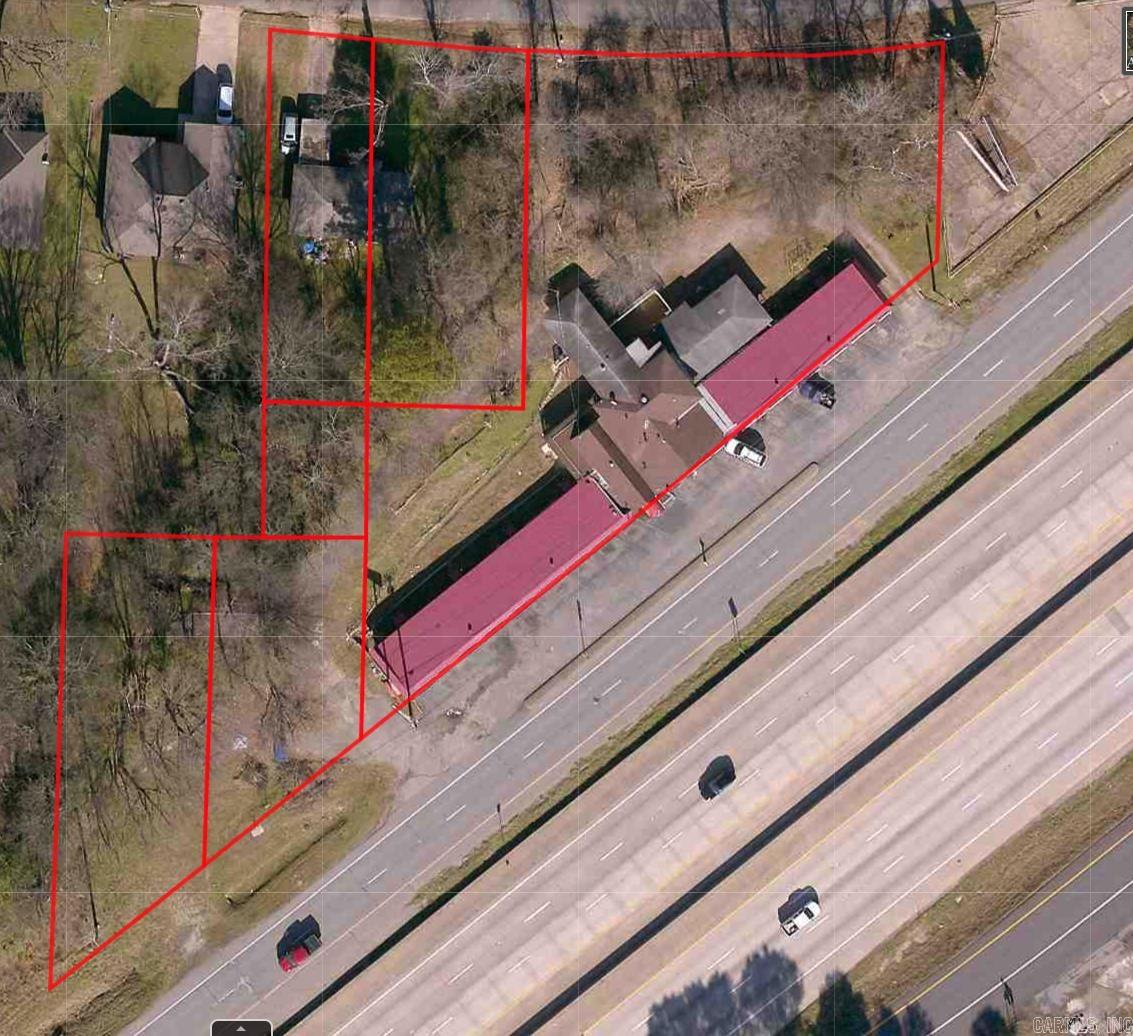 Unlock the potential of this rare commercial offering located directly off I-30 in booming Benton, AR. Spanning six bordering lots, this property includes the well-known Cedar Wood Inn, a charming Single-Family Home, and ample open space ideal for future development. With high visibility, easy access, and over 500 feet of interstate frontage, this site is perfectly positioned for a wide range of usesāhospitality, retail, multi-family, or mixed-use development. Whether you're looking to redevelop, reposition, or expand your portfolio, the possibilities here are as big as your vision. Zoned for success and priced for actionādonāt miss out on this gateway opportunity in one of Central Arkansasās fastest-growing corridors.Disclaimer: Information provided is for general purposes only. All details, including square footage, unit sizes, and renovation plans, are close approximations, with no guarantees regarding accuracy. The agent/broker makes no representations or warranties, expressed or implied, regarding the property.