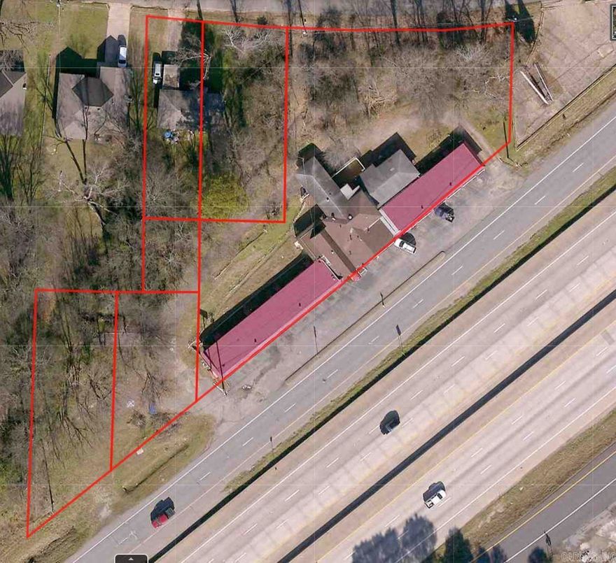 Selling price negotiable!! Unlock the potential of this rare commercial offering located directly off I-30 in booming Benton, AR. Spanning six bordering lots, this property includes the well-known Cedar Wood Inn, a charming Single-Family Home, and ample open space ideal for future development. With high visibility, easy access, and over 500 feet of interstate frontage, this site is perfectly positioned for a wide range of uses—hospitality, retail, multi-family, or mixed-use development. Whether you're looking to redevelop, reposition, or expand your portfolio, the possibilities here are as big as your vision. Zoned for success and priced for action—don’t miss out on this gateway opportunity in one of Central Arkansas’s fastest-growing corridors.Disclaimer: Information provided is for general purposes only. All details, including square footage, unit sizes, and renovation plans, are close approximations, with no guarantees regarding accuracy. The agent/broker makes no representations or warranties, expressed or implied, regarding the property.