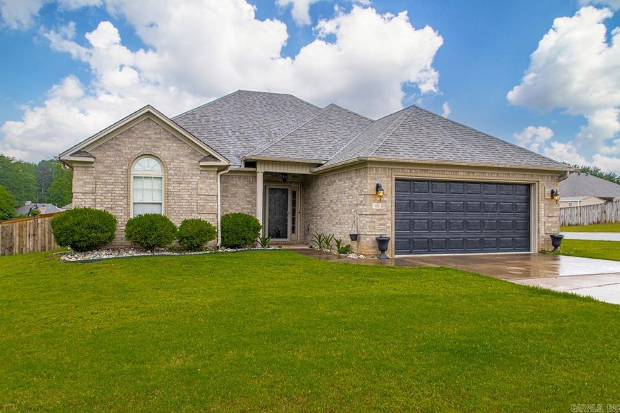 Welcome to this inviting 3BR 2 BA home on a corner lot in a nice established neighborhood. Beautitul laminate floors in the large great room, and new carpet in the bedrooms. Living room has a beautiful fireplace. Outside is a covered patio with a newly constructed patio to make more room for outdoor activities. The kids will love the basketball court to play on! This home is move in ready, and perfect to start making your own memories here!