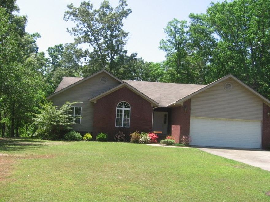 Gleaming & spotless 3BR, 2 Ba home with 1650 sq. ft.  Large living area with cathedral ceiling, & leads into dining area & open kitchen.  Lots of windows throughout.  Kitchen has tile counter tops and backsplash, porcelain sink, breakfast bar.  All appliances are included, even washer-dryer.  Laundry room is between kitchen & 2-car garage.  Master Suite has 2 walk-in closets, separate shower plus jetted tub, & 2 sinks.  Two Guest BR are large.  Ceiling fans, attic fan, 6" walls, brick/vinyl, gutters.