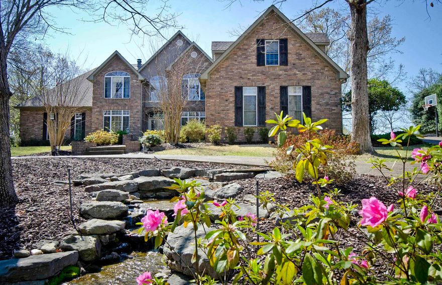 Soaring ceilings and plenty of room in this recently remodeled home. Tons of natural light and fresh updates. Primary bedroom is on main level, along with a home office. There are 4 bedrooms upstairs with a wonderful family room and "Man Cave" with a jetted tub in the full bath. Gorgeous pool and hot tub for wonderful evening get togethers! There is a safe room in basement, a large laundry room, 3 car garage with a mudroom when you enter. There is a covered boat slip with lift,  and launch ramp nearby, along with basketball goals, tennis court, and clubhouse with its own pool for larger gatherings! Not much more to wish for!!