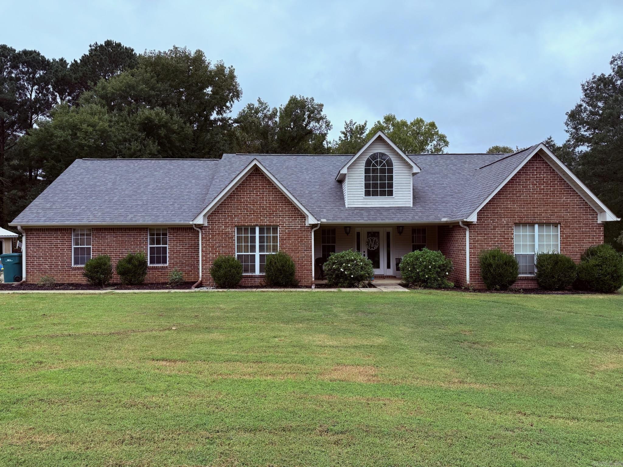 This beautiful 4BR/3BA home offers the perfect blend of comfort, space, and privacy. The inviting front entrance is framed by a landscaped yard, setting the tone for what awaits inside. The living room features vaulted ceilings, recessed lighting, and a cozy gas-log fireplace, creating a warm welcoming atmosphere. For Dining & Entertaining, there is a large separate dining area with a wall of windows that provides stunning views of the backyard and the covered patio deck that is perfect for gatherings or relaxing outdoors. The expansive kitchen includes abundant counter space, a pantry, and a stylish tile backsplash. Primary Suite offers spacious room, a large walk-in closet, plus a private bath with a soaking tub, separate shower, and double vanity. The upper level of the home offers a full bedroom, full bath, a large bonus area that can serve as a game room, or additional living space. This home offers a separate area that could be used for an office space or hobby room. There is ample closet and storage space throughout this thoughtfully designed home. Although this home is located in a subdivision, the property sits on 1.86 acres with lots of privacy. Agents see remarks.