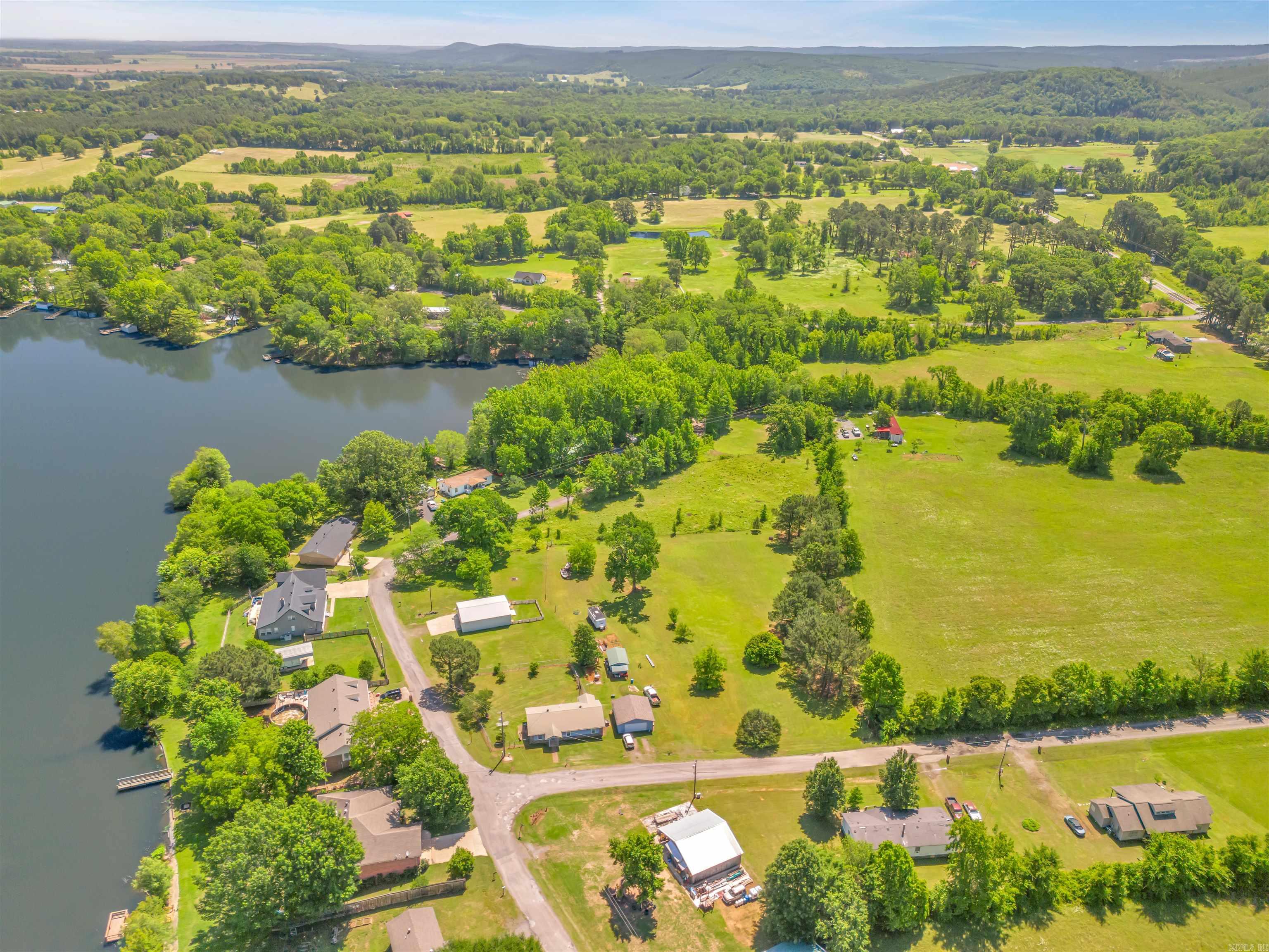 Beautiful lots right beside Harris Brake Lake! This listing is for 1.07 acre. The land is flat and buildable. City water at road. Will need state-approved septic. First Electric Coop is the area electricity provider. Connect2First provides Fiber Internet! Double wide mobile homes that are permanently affixed are allowed per the subdivision covenants. There is a dirt boat ramp right across the road from this lot. This property is situated near the Ouachita National Forest and Harris Brake Lake WMA. Enjoy everything rural Arkansas has to offer! This listing combines tract 2 (.33 acres) and tract 3 (.74 acres). These are also listed individually.