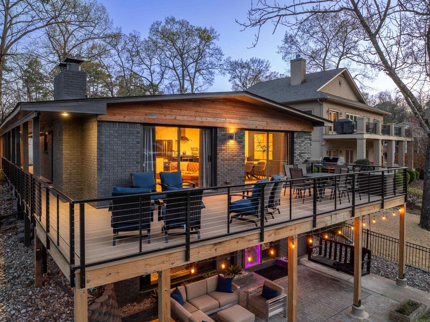 Experience lakefront living at its finest at Shadow Haven, where mid-century modern style meets top-to-bottom luxury renovation. This fully furnished, turn- key 4-bedroom, 3-bath property is already an income-producer as a high- demand short term rental, or it can serve as your dream second home or primary residence.  Perfectly located just minutes from Bathhouse Row, Oaklawn Racing, Mid- America Science Museum, mini golf, and a variety of local attractions, this home offers the ideal balance of luxury, comfort, and convenience.