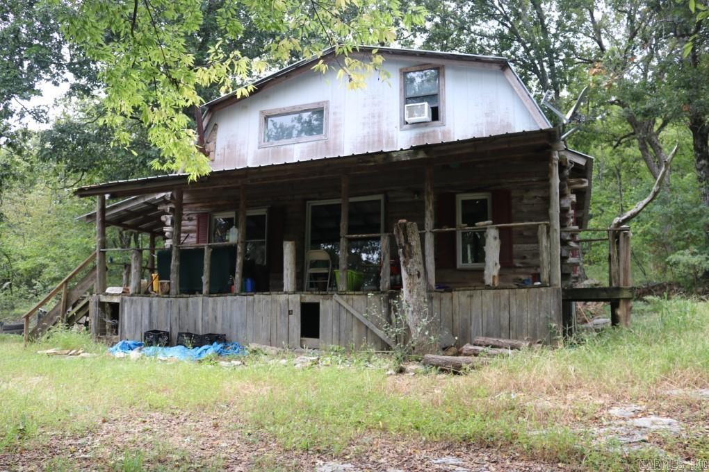 No. 02323 Discover your very own rustic haven at 121 Wickham Road, Mountain View, AR 72560. This charming cabin, nestled on 3.11 acres of pristine woodland, offers 3 bedrooms, 1.5 baths, and a world of natural beauty right outside your door. Rustic Charm: Step into a retreat with the charm of a rustic cabin. With a little TLC, this cabin could be transformed into your dream full-time residence or a perfect weekend getaway. Nature enthusiasts will delight in the abundant wildlife that calls this property home. From turkeys and deer to squirrels and a variety of birds, this wooded oasis offers endless opportunities for wildlife observation. This property is a private escape that cannot be seen from the road. Enjoy the peace and tranquility of your own secluded slice of paradise while being just a short 10-minute drive from Mountain View $88,500