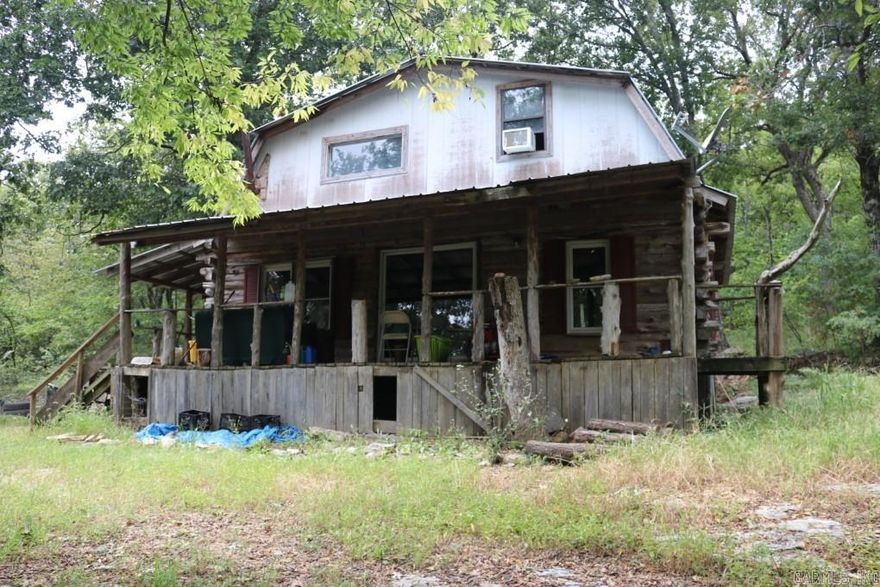 No. 02323 Discover your very own rustic haven at 121 Wickham Road, Mountain View, AR 72560. This charming cabin, nestled on 3.11 acres of pristine woodland, offers 3 bedrooms, 1.5 baths, and a world of natural beauty right outside your door. Rustic Charm: Step into a retreat with the charm of a rustic cabin. With a little TLC, this cabin could be transformed into your dream full-time residence or a perfect weekend getaway. Nature enthusiasts will delight in the abundant wildlife that calls this property home. From turkeys and deer to squirrels and a variety of birds, this wooded oasis offers endless opportunities for wildlife observation. This property is a private escape that cannot be seen from the road. Enjoy the peace and tranquility of your own secluded slice of paradise while being just a short 10-minute drive from Mountain View $88,500