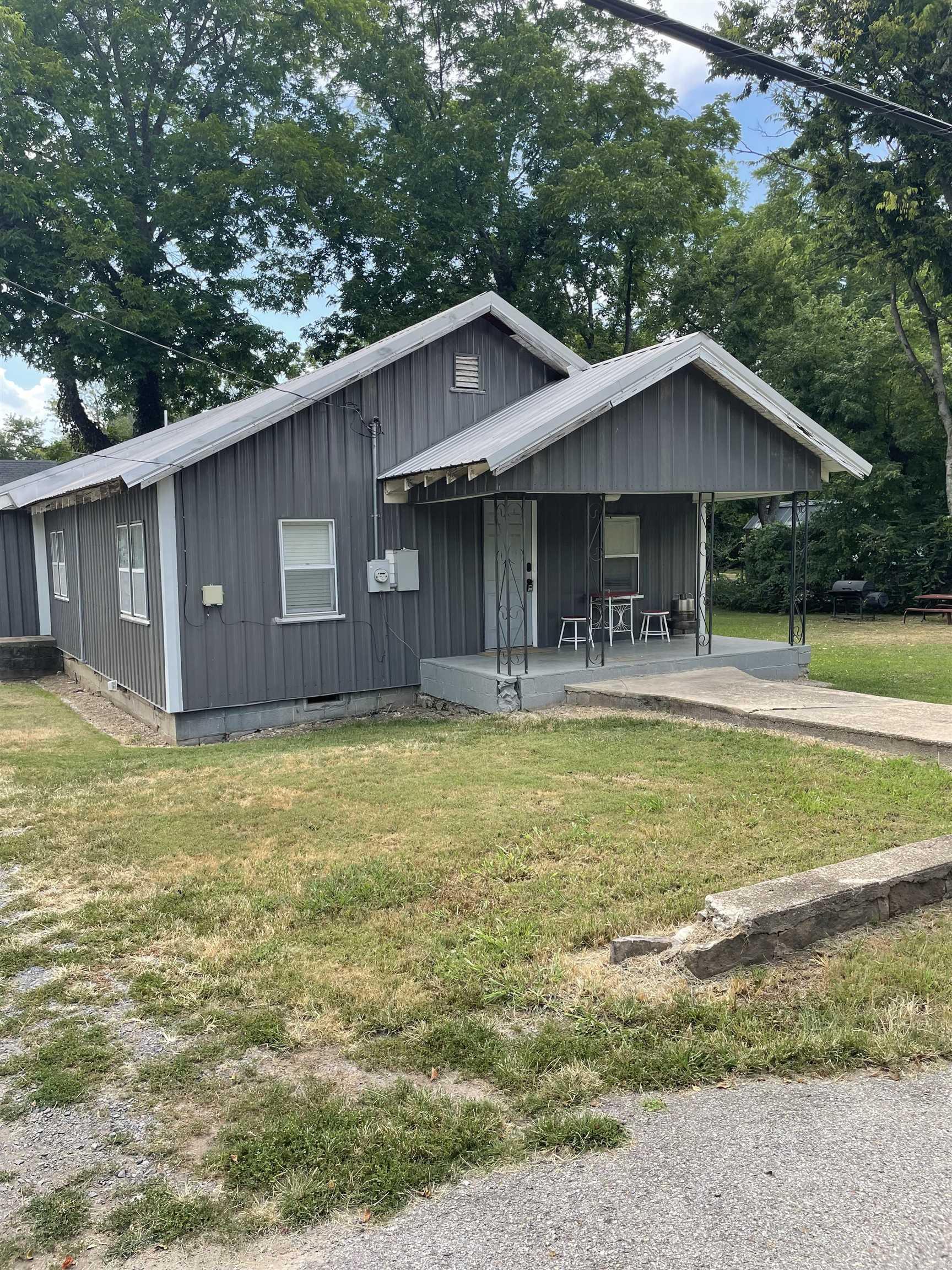 Beautifully updated 1,252 sq ft, 3 bedroom, 2 bath home in the heart of Marshall, Arkansas. Located just off the historic courthouse square and minutes from the Buffalo National River. This home features an open floor plan with new flooring, modern kitchen with stainless steel appliances, updated bathrooms, fresh paint, and move-in ready condition. Spacious bedrooms, and abundant natural light throughout. Level yard with shade trees, firepit, and space for outdoor entertaining. City utilities, high-speed internet available, and easy access to local dining, shopping, and schools. Perfect for full-time living, vacation home, or short-term rental investment.