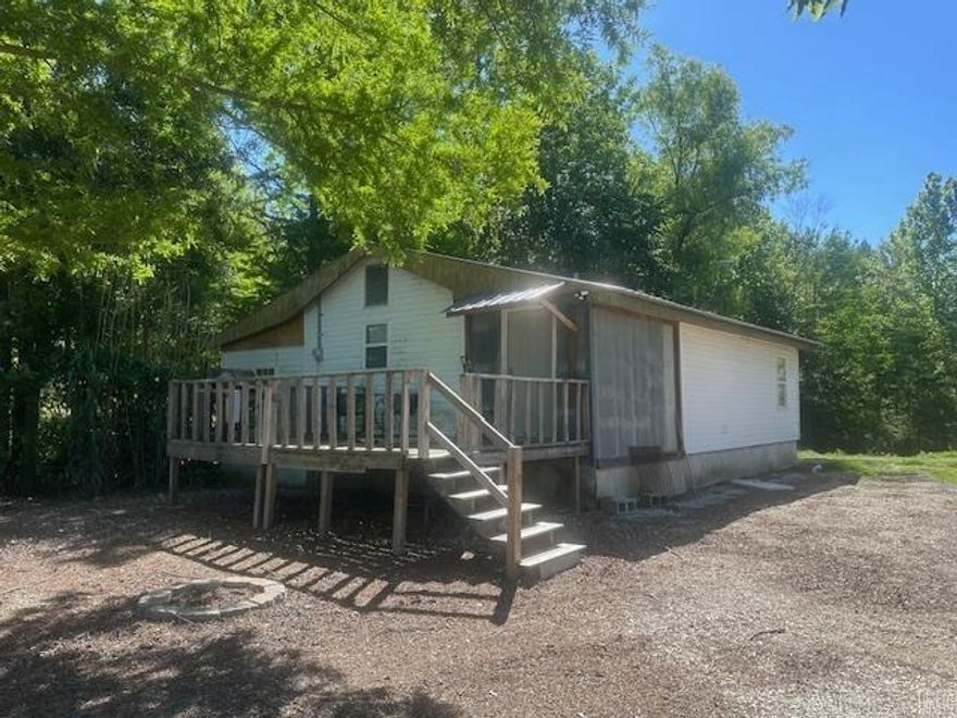 Escape to the river with this fully furnished duck hunting and fishing cabin on the St. Francis River! This 2 bedroom, 1 bath retreat offers the perfect blend of relaxation and outdoor adventure. Enjoy peaceful mornings and river views from the deck, or head straight to the water from your private floating boat dock. Inside, the cabin features a tub/shower combo and comes complete with all appliances and furniture remaining making it truly move-in or getaway ready. Whether you're searching for a hunting camp, fishing retreat, weekend escape, or investment opportunity, this riverfront property is ready for memories to be made!