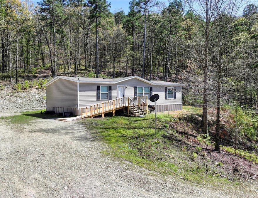 QUIET COUNTRY LIVING ON 2.5 +/- WOODED ACRES! This 3 bed, 2 bath home in a peaceful rural area is only 20 minutes from Downtown Hot Springs. Built in 2019 and well maintained. It's outside city limits so could be a great short term rental or homestead.  Open concept kitchen, dining and living room are perfect for gatherings and everyday living. Kitchen has a large island and plenty of storage for all your cooking and hosting needs.   Master suite has walk in closet and garden tub with step. There's 2 more well sized bedrooms and a bath plus a separate laundry area.  Outside, there's a storage building, a workshop that's heated and cooled, and RV parking with hookups.   This well kept home in a peaceful country setting has many possibilities!   COME AND SEE!   Agents - Use Showing service to schedule all showings.