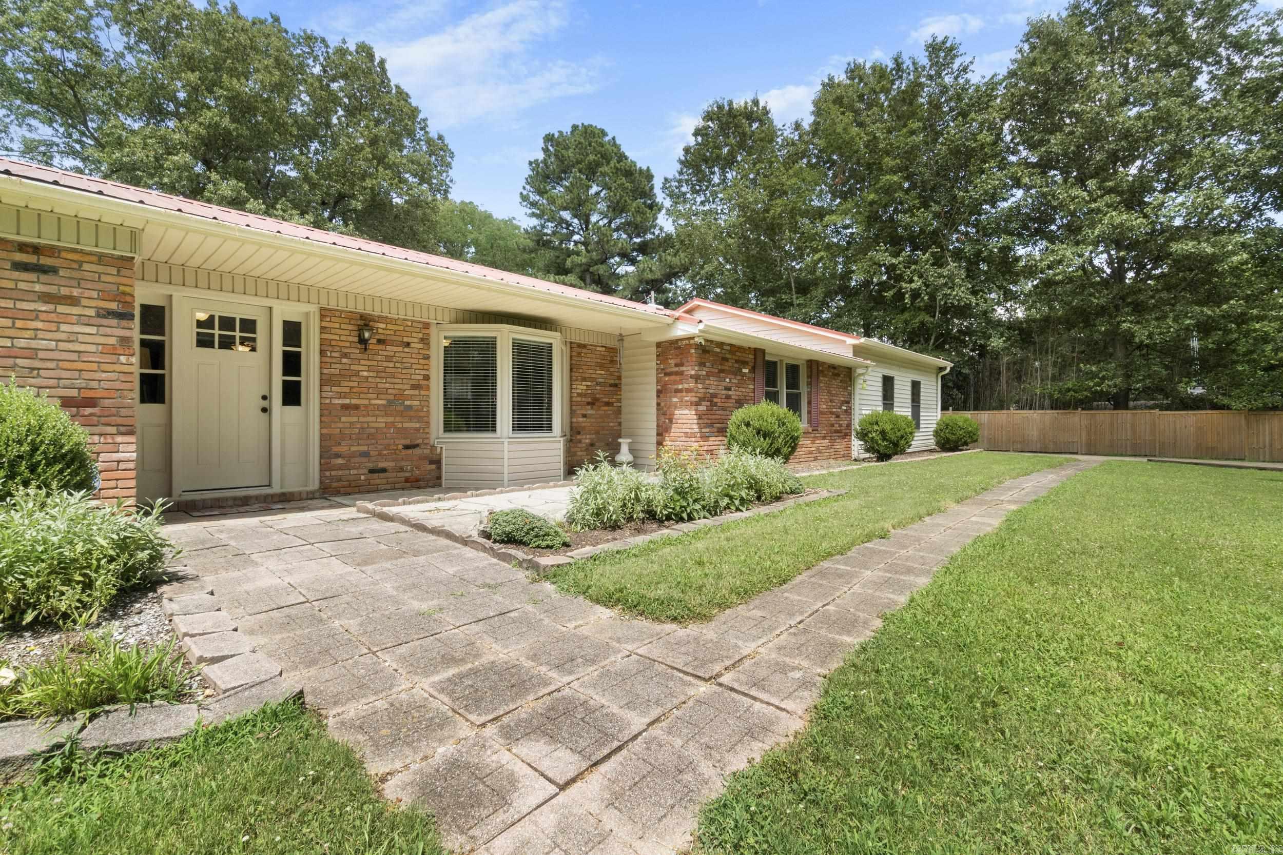 Discover the perfect blend of nature and convenience on this updated 3 bed, 2 bath home nestled on a .65-acre lot just above town. Enjoy peaceful wooded views while staying close to everything you need. Inside, the open-concept living space is filled with natural light and features an exposed brick gas fireplace. The updated kitchen is perfect for gathering, offering recessed lighting, generous cabinetry, pantry, breakfast bar, and cozy dining nook. French doors open to an 8x20 deck and 12x25 concrete patioāyour private backyard retreat surrounded by trees and birdsong. The spacious primary suite, refreshed finishes, and thoughtful layout make this home both stylish and functional. A 700 sq ft attached garage is a true bonus with ceiling fans, recessed lighting, gas fireplace, and insulated doorāideal for vehicles or workshop use. A 12x16 shed adds storage, and the extended driveway includes a pad for your boat or RV. Move-in ready with updates throughoutāthis home has it all!