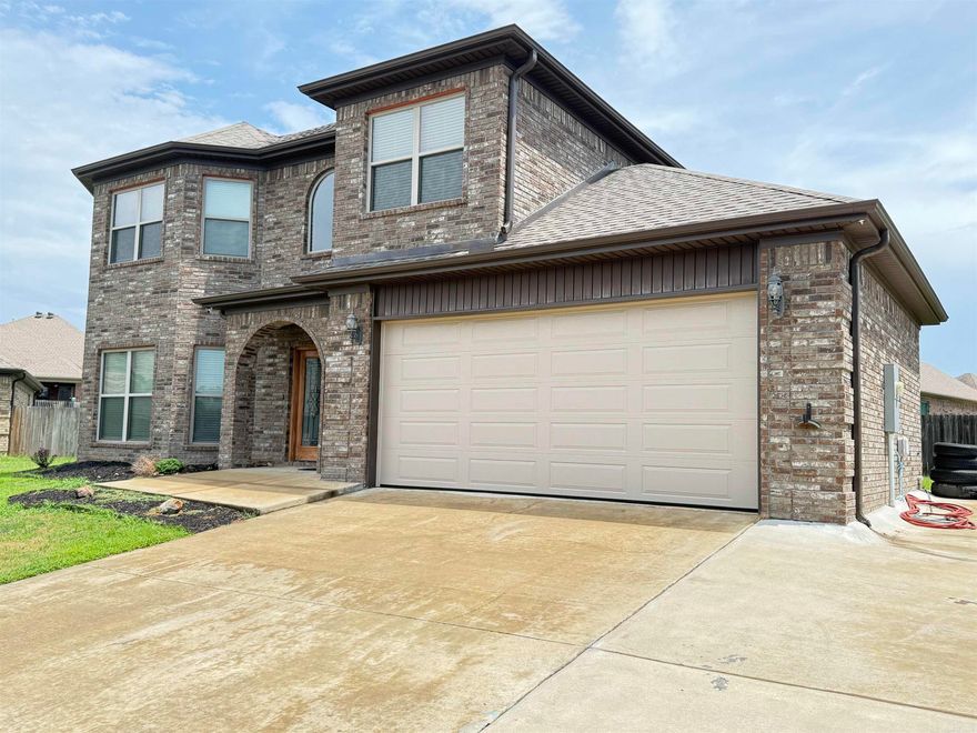 Stunning executive home with breathtaking lake views! This beautifully designed 4-bedroom, 2.5-bath home offers elegant living with an open, functional layout. The spacious den features a cozy gas fireplace, while the kitchen/dining combo—or optional hearth room—creates the perfect gathering space. The kitchen has granite countertops, a gas stove, pantry, and breakfast bar.  A flexible area just off the kitchen is ideal for a formal dining room or an eat in are with a second living space. From the moment you approach the striking iron and frosted glass double front doors, this home exudes luxury and sophistication. Enjoy the ease of NO carpet—tile flooring downstairs and durable wood-look flooring upstairs make this home both stylish and low-maintenance. The primary suite is large with his and her walk in closets.  Primary bath has double sinks, jetted tub and seperate shower.  The oversized two-car garage, additional parking pad, and quiet circle drive complete the package. Currently listed 10K under most recent appraisal. Call to schedule you showing today!