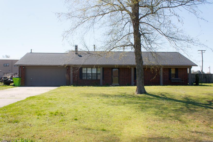 Location!!! Location!!! This is a great home move in ready.  Since 2024 has new paint, flooring, a room converted to an office plus a  new roof in 2023.In the back is a 20x24 shop with roll up door, privacy fence, and  an inground pool.  Plus a covered patio.