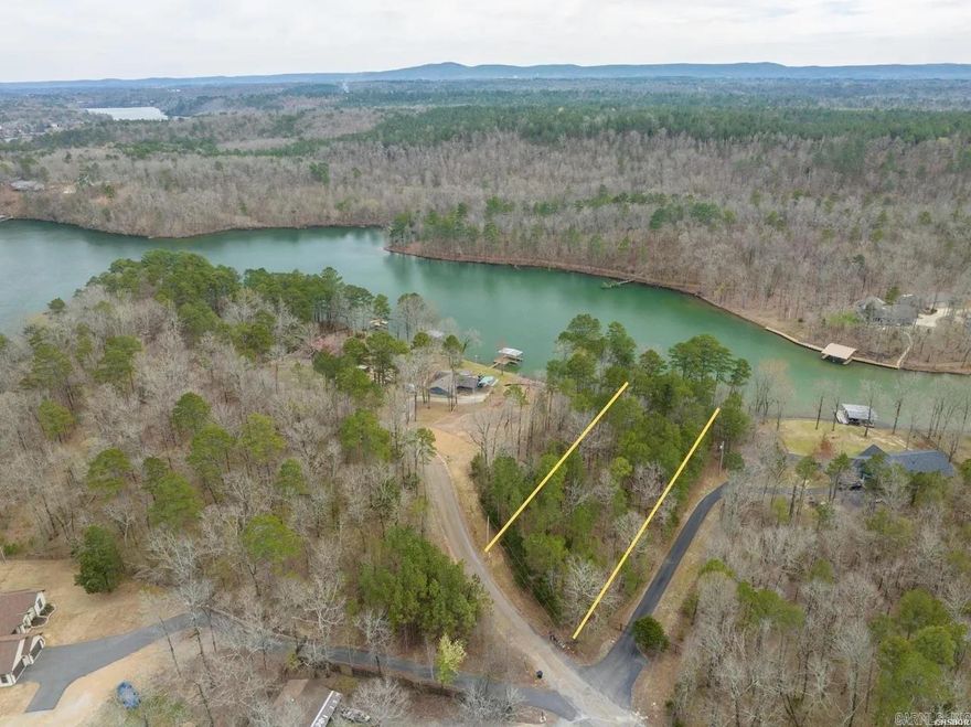 Great buildable lot directly on Lake Hamilton. Water and electric at the road. .81 acres Prime Lake front property. NO restrictions!