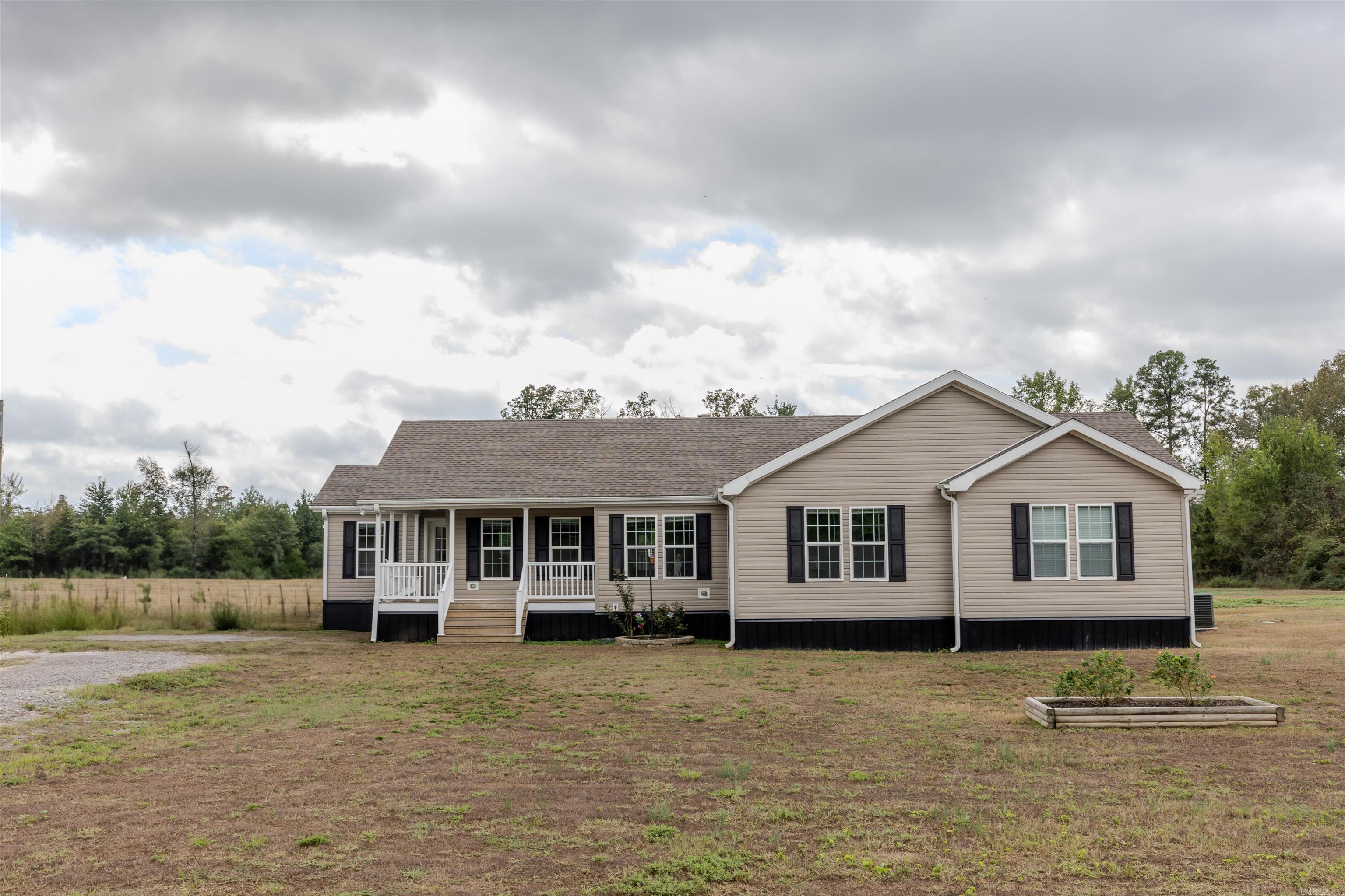 Built in 2019, this charming country home sits on 6.47 acres and includes a 30’x40’ shop with 200-amp service and concrete floors. Attached is a 10’x35’ barn equipped with both power and water, making it perfect for livestock or storage. The land is fully fenced and cross-fenced, ideal for grazing animals or rotating pastures. You’ll also find raised garden beds and plenty of wildlife roaming the property, giving it a true homestead feel. Inside, the home offers 4 bedrooms, 2 bathrooms, and an open-concept kitchen, dining, and living area—great for everyday living and entertaining. Fiber internet is available, making it easy to work from home while enjoying the peace of the countryside. All this just a short drive to Conway—come start your homestead dream here!