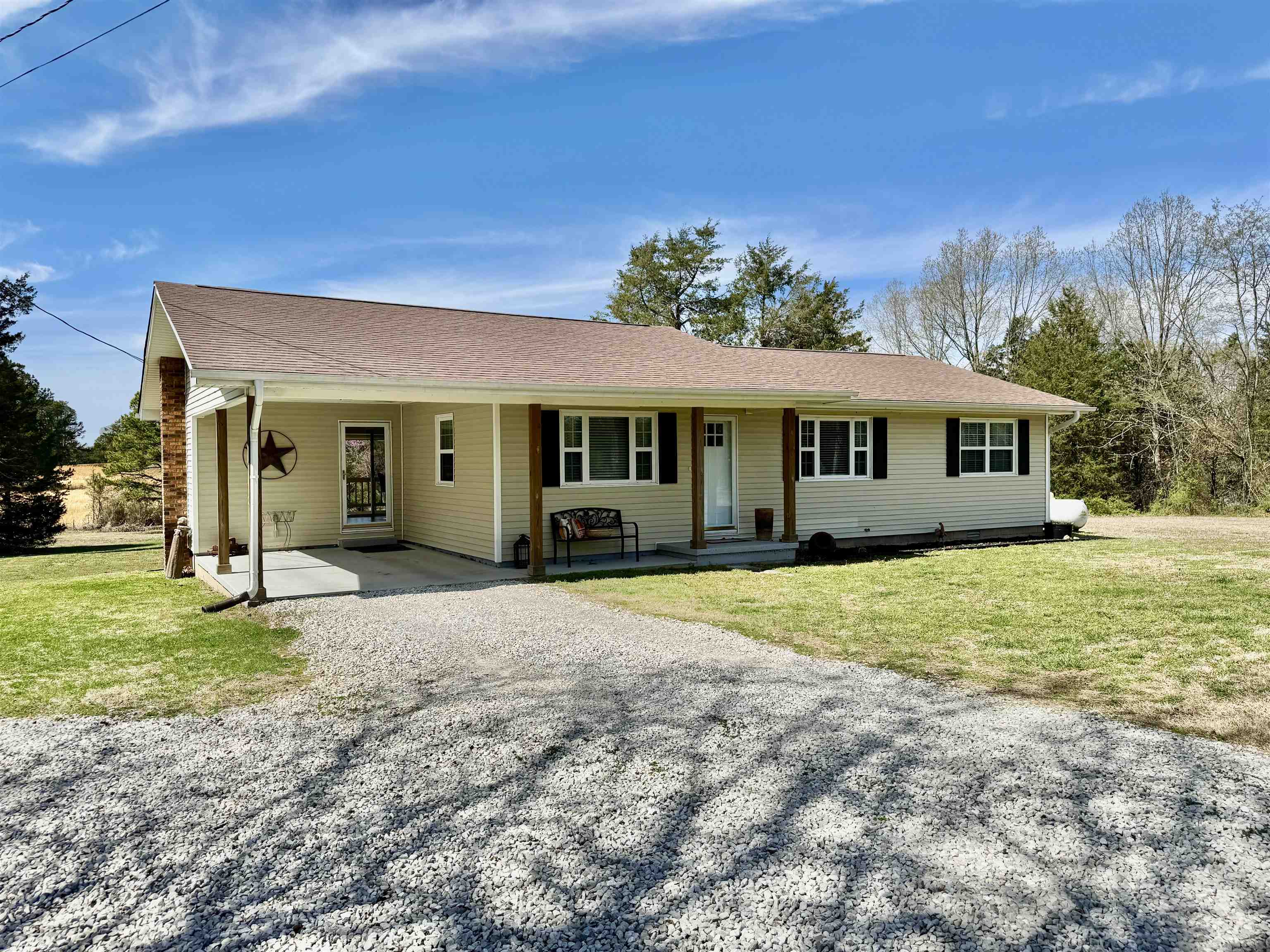 Welcome to this stunning, completely remodeled 2-bed, 2-bath modern home on 2 acres! This spacious home features a large living area perfect for relaxation. The kitchen offers an island and sleek quartz countertops. The master suite has an attached full bath with a walk-in tile shower. Outside, you'll find a large back deck ideal for grilling and enjoying the outdoors. A well-equipped storage building with power is included, providing extra space for all your needs. There is an attached 1 vehicle carport and a detached carport that will convey. Located on a paved road! Call to see this property today!