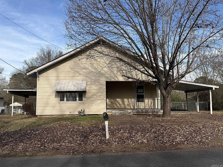 This inviting home offers a flexible layout with charming details and outdoor features to enjoy. From the welcoming front porch, step into the living room featuring original wood flooring. The space flows into the kitchen and dining area, then straight through to the laundry room. Beyond the laundry room is a versatile flex room, with a private bedroom and full bathroom located to the left. Across the flex room, a hallway leads to a second full bath and an additional bedroom that wraps back into the living room, creating a connected and functional floor plan. A deck off the first bedroom overlooks a fully fenced backyard with two storage sheds and a storm shelter, offering added storage and outdoor utility. With multiple living spaces and room to personalize, this property presents an appealing opportunity for buyers looking to make it their own. Find this property at HUDHomestore.