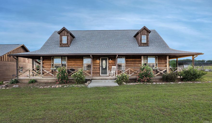 Step into a pastoral painting. Peaceful, 22.88 acre country estate includes a stocked fishing ponds, a horse and cow barn and approximately 20 acres of fenced pasture. Convenient to both Benton and Hot Springs, this custom built 4 bedroom 3 bath log home provides plenty of room for family and friends. Bright, remodeled kitchen, great room and upstairs loft are great for entertaining. Oversized 30x60x14 motorcoach shop (water/electric/sewer hookups) with loft storage and 3 car carport with large multipurpose room allow space for everyone’s work or hobbies. New HVAC system (2026) and roof (2024) offer peace of mind. View amazing sunrises and sunsets from the wraparound porch.