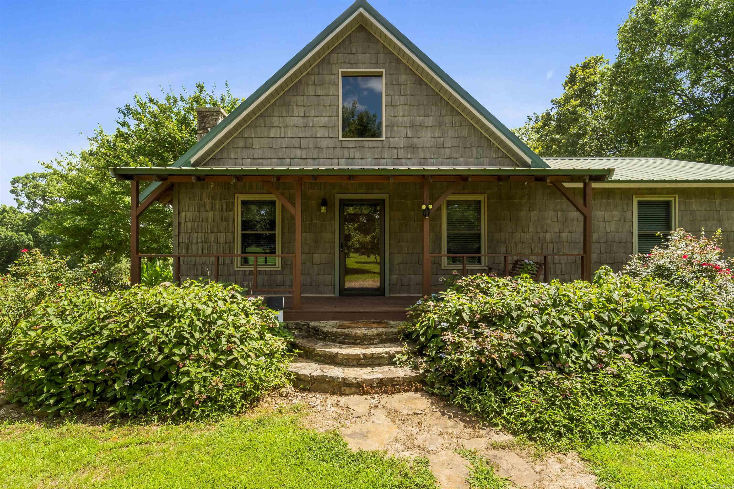 Beautiful home! 1768 Sq ft, 3br 3bath sitting on 8.61 Acres. Beautiful Ceder walls and ceilings thru out. Kitchen has stainless appliances and beautiful wood cabinets with a bar. 2 bedrooms on main level and 1 bedroom upstairs. To go to the upper level you can use the stairs or the stair lift chair. Property has a 26x43 Shop with 12 x26 lean to, fenced garden and 2 box deer stands, 3 Metal carports, and other out buildings. Plenty of room for boats, yard equipment, etc.. Very private and secluded. Nice quiet neighborhood. Sellers say they will also sell the home with less property if buyer doesn't want the full 8.61 acres. House & shop can be purchased with 3 m/l acres.This wont last long so drive by and give us a call today.