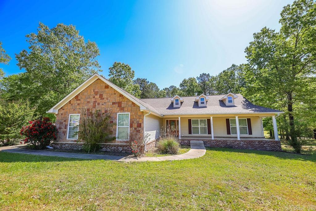 Welcome to 169 Whispering Oaks! This charming 4-bedroom, 2-bath home sits on a peaceful 3-acre lot with plenty of updates throughout. Enjoy the perfect blend of comfort and space, nestled in a serene setting with room to grow and relax. A true country retreat awaits.