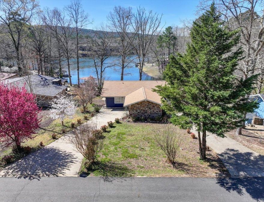 Lakefront Home – Updated & Active Short-Term Rental  Beautifully updated 3BR/2BA lakefront home on Lake Desoto—perfect as a full-time residence, vacation getaway, or active short-term rental.  Also offers basement with full bath - more room to add space or a gameroom!  Recent updates include: • New HVAC (Mar 2024) & compressor (Oct 2024) • New roof (Oct 2024) & water heater (June 2024) • New oven (2024) • Updated dining room walls (Oct 2024) • New laminate flooring in living room & guest bedroom • Fresh interior & exterior paint • New stone patio & lakeside deck (2023)  Interior features: • Open layout with stone fireplace • Water views from primary suite • Modern finishes throughout  Exterior features: • Spacious stone patio with firepit • Covered boat dock with slip • Extra storage in carport & walk in basement - workshop or gameroom opportunity - also has a full bathroom!  Active short-term rental. Furnishings, appliances, and kayaks may convey with acceptable offer.  Agents: Please contact Showing Service to schedule all showings.