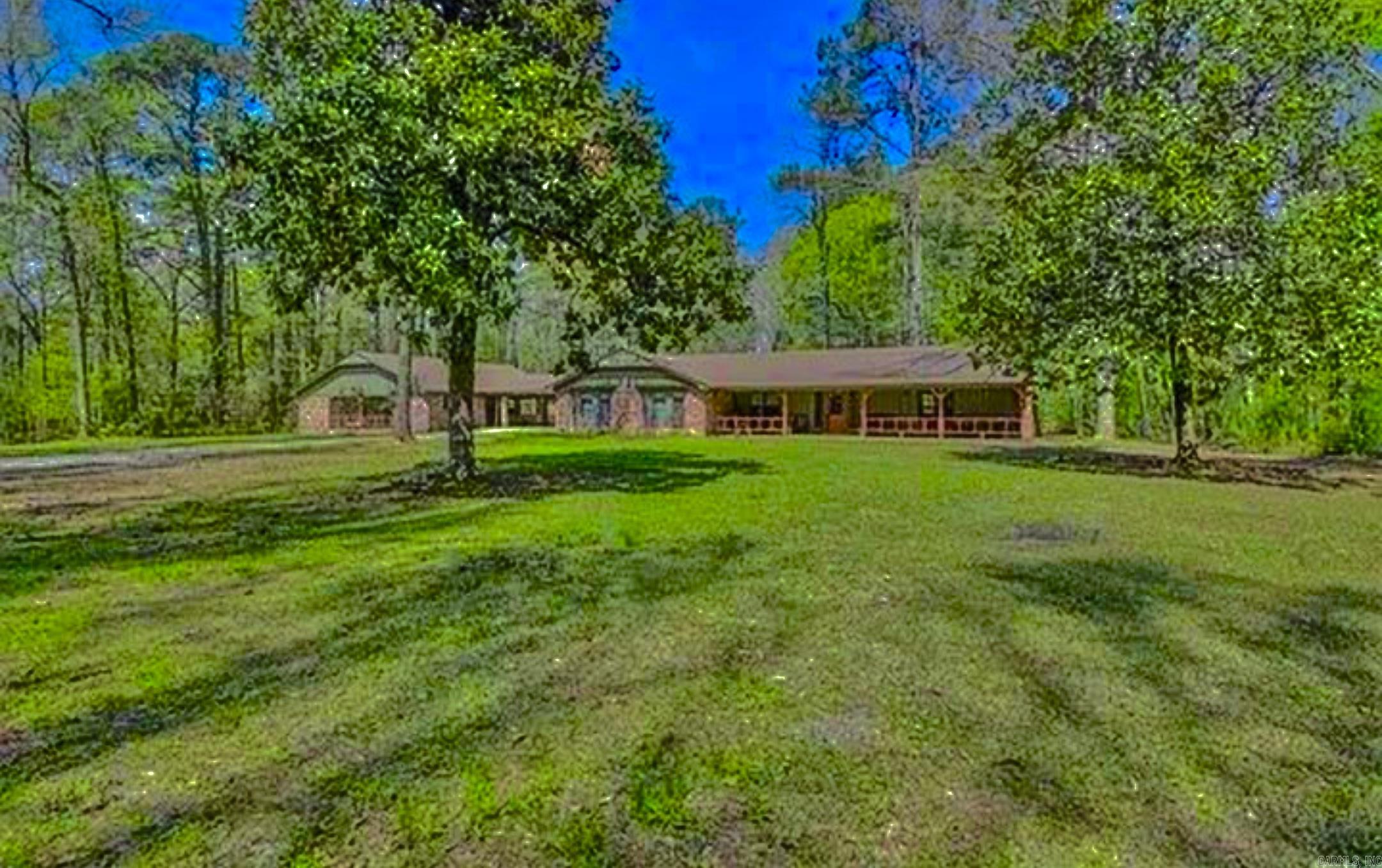 Welcome to this beautifully updated 3,599 sq. ft. home, perfectly blending comfort, space, and modern living. Featuring 4 spacious bedrooms, 3 full bathrooms, and stylish upgrades throughoutāincluding granite countertops, laminate and tile flooring, and a cozy wood-burning fireplace The open layout offers plenty of flexibility with a formal living room, family room, office/study, and in-law quarters. Additionally, a private 701 sq. ft. garage apartment with 1 bedroom and 1 bath is ideal for guests, extended family, or rental income. A large detached workshop is also includedāperfect for hobbies, storage, or business use. Set on over 5 serene acres, the property offers a peaceful mix of wooded and open areas, along with a welcoming porch, guest house, and 2-car carport. Experience the best of country living with the convenience of easy access to town. Donāt miss your chance to see it in person. Schedule your private tour todayāseller is motivated!