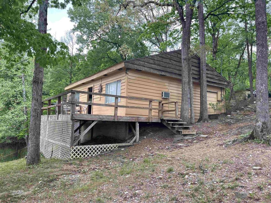 2BR 1A with beautiful view of Lake Norrell and flat lot walking to the lake which is hard to find. Includes the one acre behind it with the pond. Property has not been hooked up to city water but it is available. Sold as is with no disclosure.