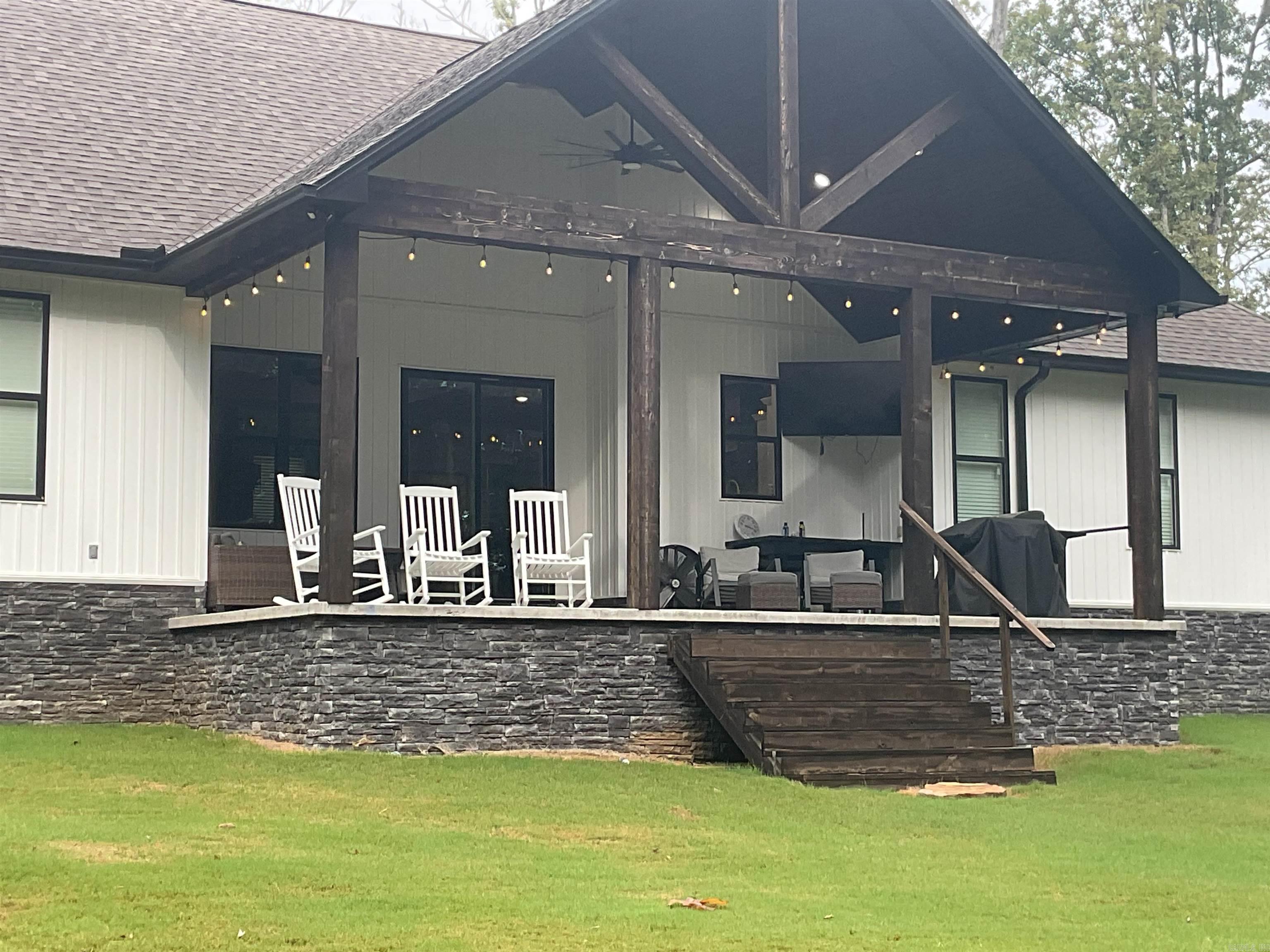 BRAND SPANKING NEW AND A BEAUTY IS THIS LAKEFRONT HOME with lake in your backyard with all of its playground fun including boating-swimming-tubing. How about going to a restaurant by water? (OH YEAH!!) AND THE GOLF COURSE IS A MINUTE OT TWO with a golf cart. Home features Open floorplan, fireplace, breakfast bar, open dining area, split bedroom floorplan, separate utility room and wow oh wow what a BUTLER;S PANTRY ROOM. Upper level has your second master s with your main master suite on ground level. great rear deck with its own summer kitchen area. Gather round the outdoor firepit for a beverage after a long day playing on the golf-course or the lake. BOAT carport included. all furnishings and home can be purchased for $620,000