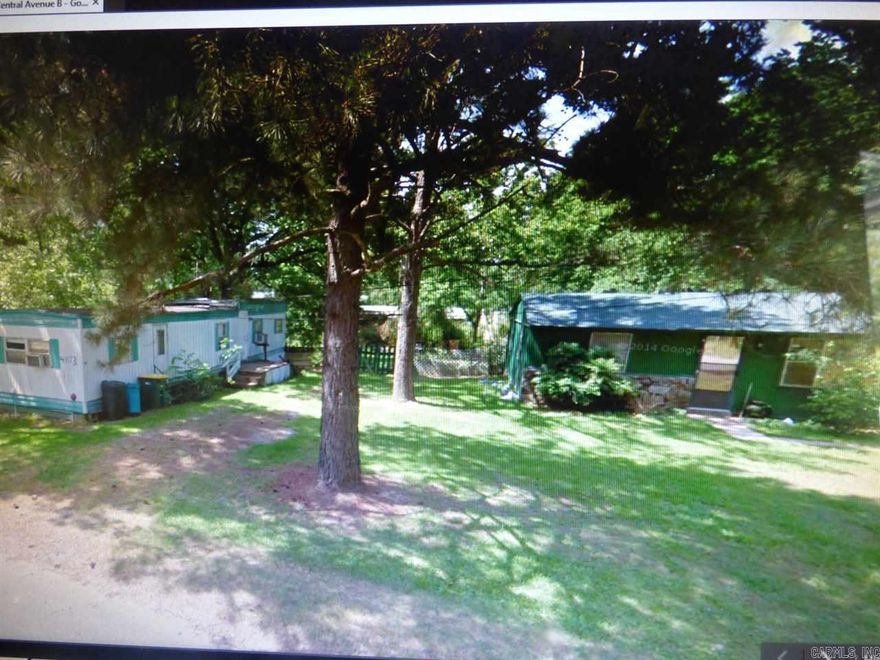 Cute 2 bedroom 1 bath on 2 large lots.  There is a mobile home on site that conveys which is 2 bedrooms 2 baths- great rental property. Property  "AS IS" seller provides no warranties or disclosure.  Listing Broker & seller assume no responsibility and make no guarantee  or warranty. Measuring encouraged