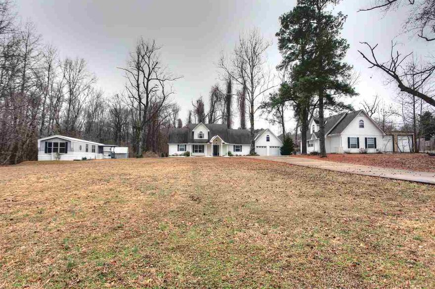 Great looking home on 3.63 acres with 2 rental properties on it!  Home offers hardwood, kitchen with dining, saferoom, fireplace, trees on back of property, upstairs attic is partially finished and plumbed for an additional 3 bedrooms and one full bath.