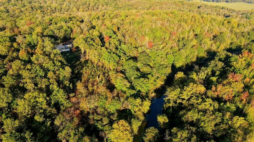 A rare combination of privacy, beauty and opportunity. Nestled down a well-traveled dirt road, this private 10-acre property offers a peaceful wooded setting with a stunning vista view. The land touches the Strawberry River, adding a unique natural feature, though direct access is currently limited.  The residence is a 2023 Clayton mobile home with a spacious addition, featuring three bedrooms and two bathrooms. Additional improvements include an RV carport, a storage shed, and a walk-in storm shelter for added safety and convenience.  This property combines natural beauty with functional living space, making it ideal for those seeking a quiet retreat or a full-time residence surrounded by nature.