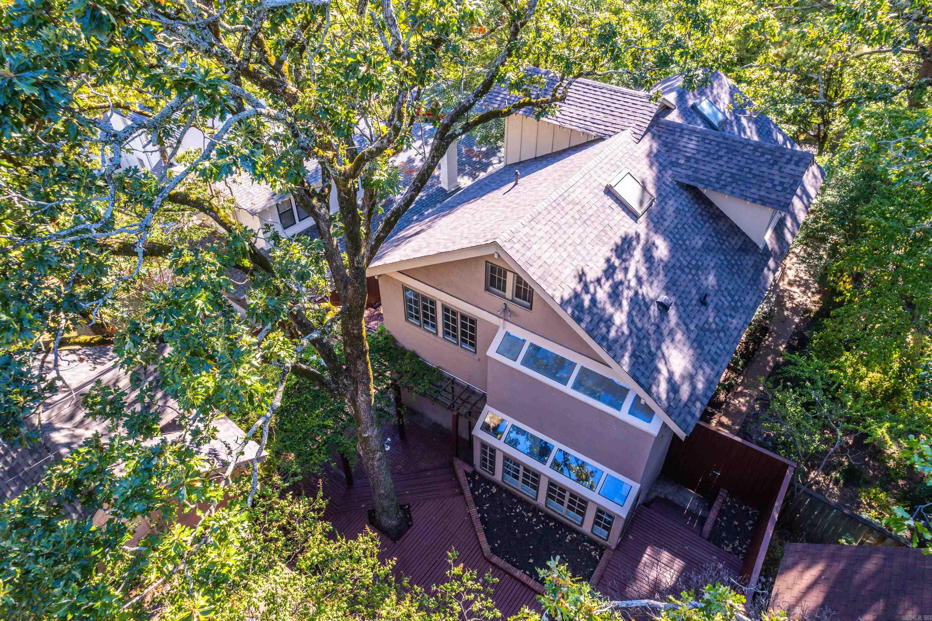 This stunning Craftsman home in the heart of Midland Hills offers a rare blend of historic charm and modern living. Coveted for its prime location, this spacious three-story home (with basement and wine cellar), boasts an inviting kitchen, designed for entertaining. The unique third- floor master suite, with its private sky windows, provides an ideal retreat for stargazing or relaxing under the night sky. Whether for an au pair or a family member seeking extra privacy, this space is perfect. Soaring ceilings, real hardwood floors, and timeless architectural details add sophistication throughout. The beautifully landscaped backyard is an entertainer's dream, featuring a pergola and fire pit area, perfect for family gatherings. With ample parking and storage, this home is an extraordinary find and a must-see.