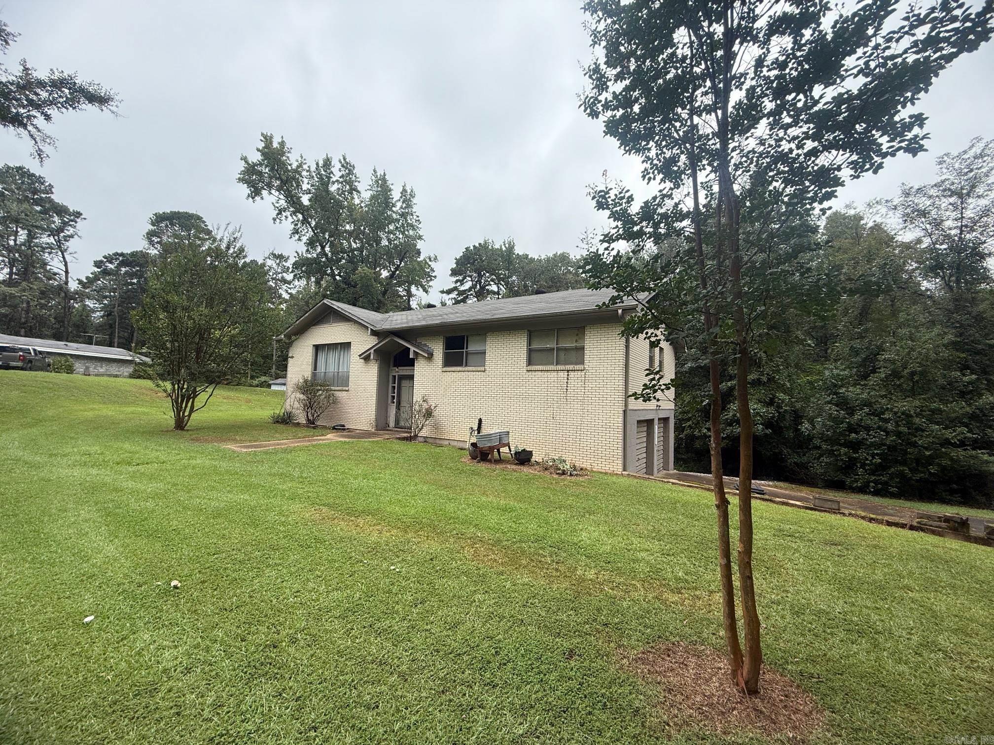 This one-owner home is a well-built, split level, 3-bedroom 2 bath home with walk out basement. The basement contains a bonus room, laundry room and 2-car garage. The upstairs has 3 bedrooms and 2 baths, large living room and a kitchen/dining room combo. There is a walk out deck off the kitchen. The asphalt driveway and the 2.15 acres makes it a picturesque country scene but close to all the amenities of town. It is a fixer upper and ready for the new owners to bring it back to life. Make an appointment today.