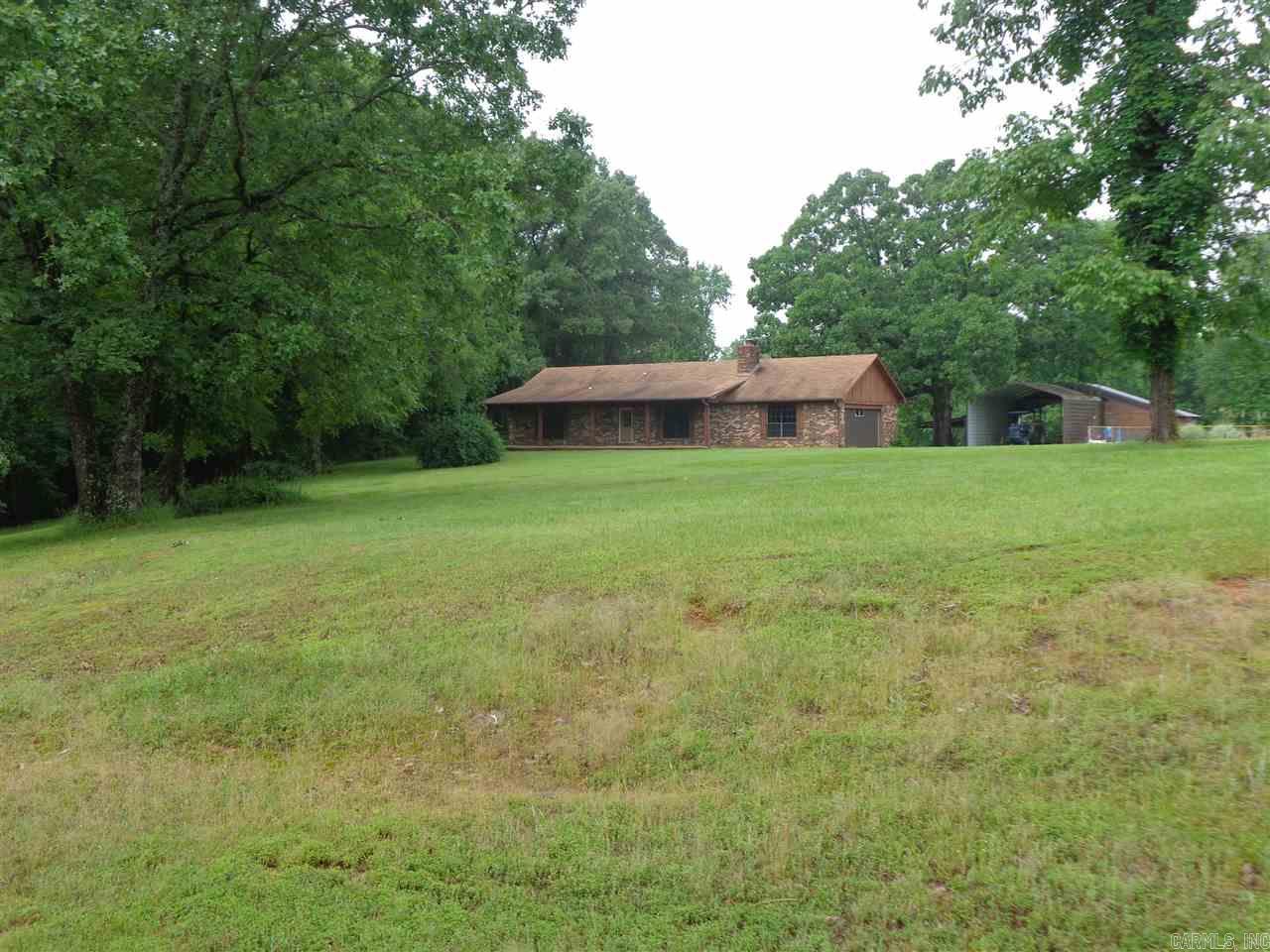 Ready to start your own farm or want a quiet place to build your dream home; At the front of this property is a move in ready 2 bedroom 1 bath all electric home, has WBFP with blower insert, extra propane heater, large great room, open dining kitchen with breakfast bar, bath has walk in shower, one bedroom with double closets, other has WIC and sliding door to covered patio. City water and separate 200' well. 37 fenced & cross-fenced level acres, large pond, Barn, Tractor / RV shed. Pre-Qual Ltr Required.