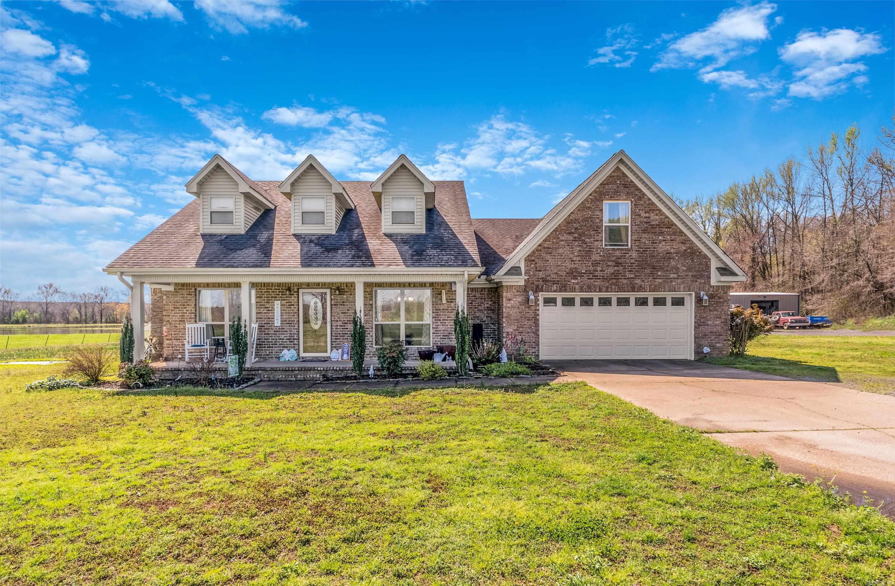 This Stunning 2006-built home boasts classic Charm with a welcoming front porch, custom swimming pool adorned with a mesmerizing rock waterfall. Home has covered front and back porches ideal for viewing sunsets. Primary suite features all the modern amenities. Set on a sprawling 155 acre estate. Discover the epitome of natural splendor, picturesque ponds and dense woodlands that create a haven for wildlife such as deer and turkey. The landscape consist of cross fenced pastures each with their on water source for rotating cattle. Property includes large shop with bathroom and additional barn for farm implements. Property may be sold in smaller parcels. #startyourmovetoday