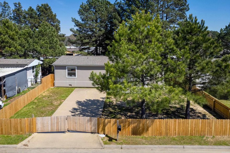 Welcome to this charming and meticulously maintained mobile home. As you step onto the property, you'll be greeted by a fully fenced yard, encompassing the entire perimeter with two gates, ensuring both security and convenience. The home has 3 bedrooms, 2 baths, a laundry room and great outdoor space. New HVAC installed in 2024.