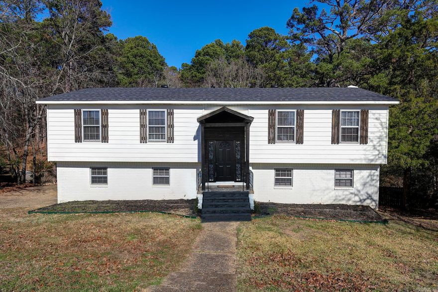 Updated 4br 2.5ba in the coveted Walton Heights area. This cute split level has been recendtly renovated and updated and features a large almost 1/2 acre lot abutting a trail thru the neighborhood, a new roof and new Hvac. The main level features the kitchen, dining, oversized living room, 3 bedrooms and 2 full baths. When you make your way down stairs you will find a bonus room/den with site build wood burning fire place, a large laundry room, bedroom, half bathroom, large 2 car garage with new doors/lifts and large inside storage area.