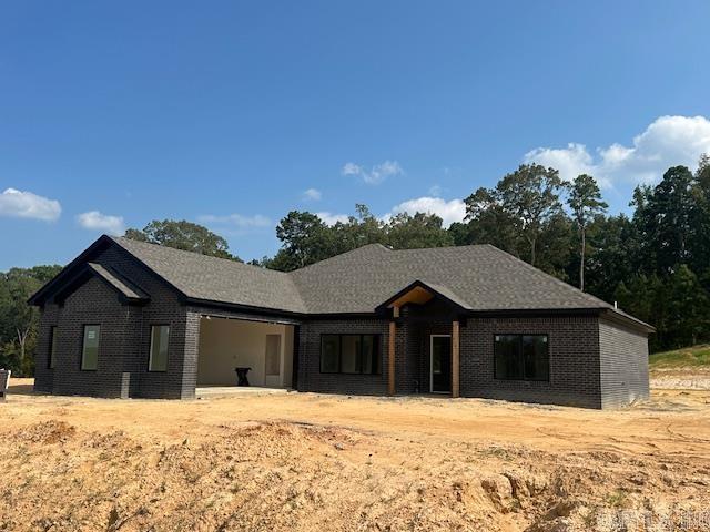 Brand- new construction sitting on 1.12 acres in the new Winchester Estates Subdivision. This 3-bedroom, 2-bathroom home offers an open/split floor plan designed for modern living. The primary suite features a spacious walk-in closet, a luxurious walk-in shower, and a relaxing soaking tub. Nestled against a peaceful wooded backdrop, this property provides both privacy and charm. Bauxite School District!! Hurry and schedule your showing today!!