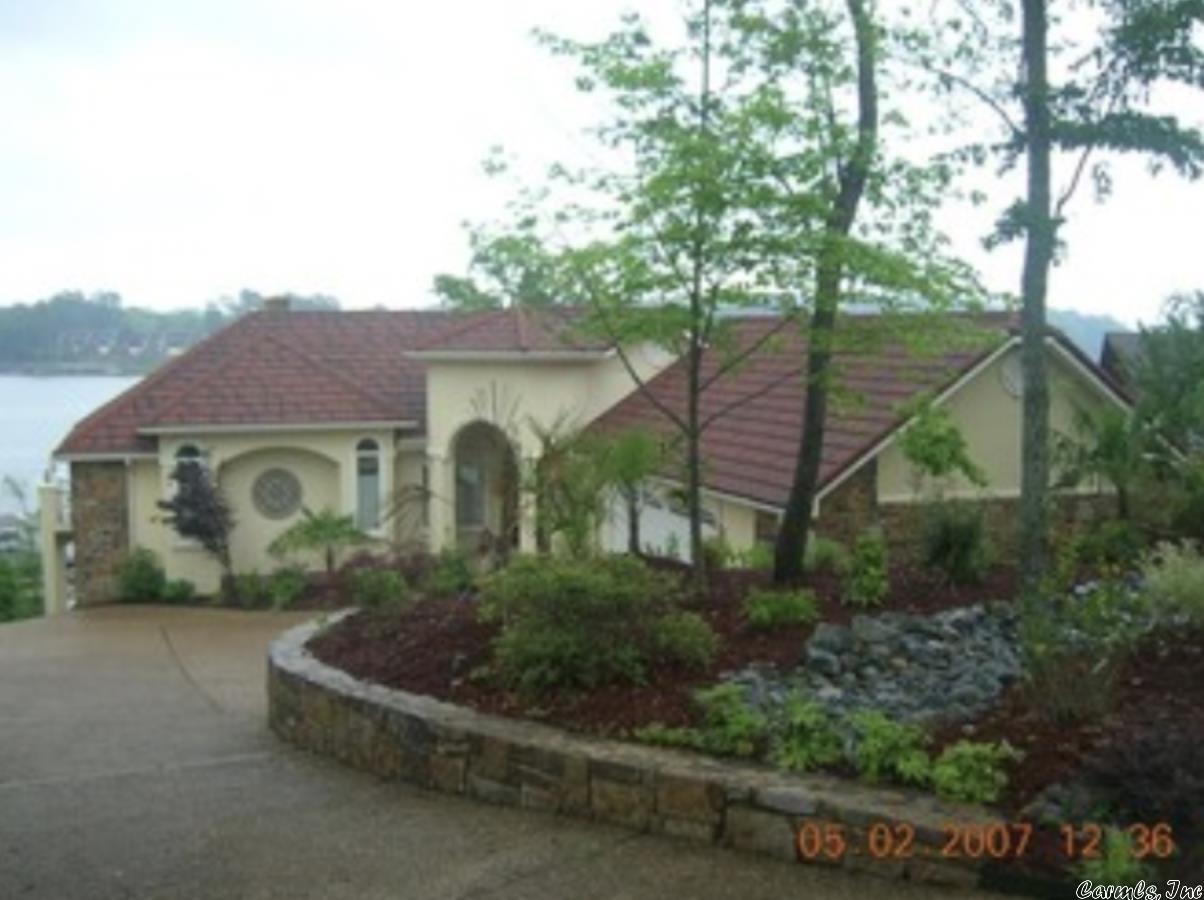 Lovely 4-bedroom, 3.5 bath home on the main channel of Lake Hamilton. Home has had numerous updates and boasts views of the water from almost every room. Year-round deep water with a boat and jet ski dock.