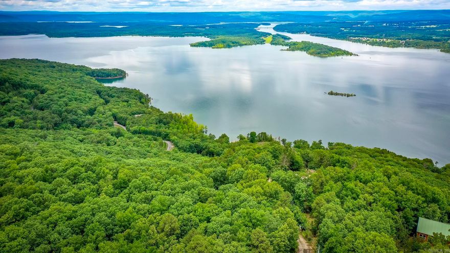 Experience breathtaking, panoramic vistas from this exceptional 5.33-acre lot situated off Diamond Bluff Road. Perched above the shimmering waters, this property boasts commanding views over the expansive lake and down the scenic Narrows—offering sunsets and sunrises that will leave you in awe. The site previously featured a 3,000+ sq ft home, which was recently cleared following a fire, making this the perfect blank canvas for your custom retreat. All the essentials are already in place, including a gated driveway, established landscaping, septic, water, excavation and on-site power—saving you both time and expense as you bring your vision to life. Embrace the tranquil lifestyle with easy access to three nearby marinas, ensuring endless opportunities for boating, fishing, and lake adventures. Whether you’re seeking a serene escape or an entertainer’s paradise, this rare offering is ready for you to build the luxury home of your dreams. Don't miss out on this incredible opportunity—your slice of paradise awaits!  See Attached Documents