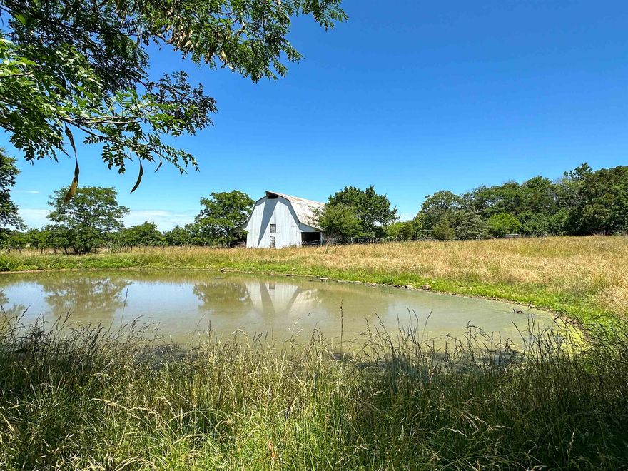 Nestled in the picturesque landscapes of woods and rolling pastures, this 49 acre =/- parcel is being separated from of a larger generational farm and  presents a rare opportunity to embrace the essence of rural living. This parcel features a very old home site, two ponds, and an old barn. The property is fenced and you have several building site options. Hunting on this property includes deer, turkey, and small game. Strawberry River frontage rounds out this amazing property. Come with a vision, a love for tranquility, wildlife and build your dream home today. Call to schedule a time to view this property.