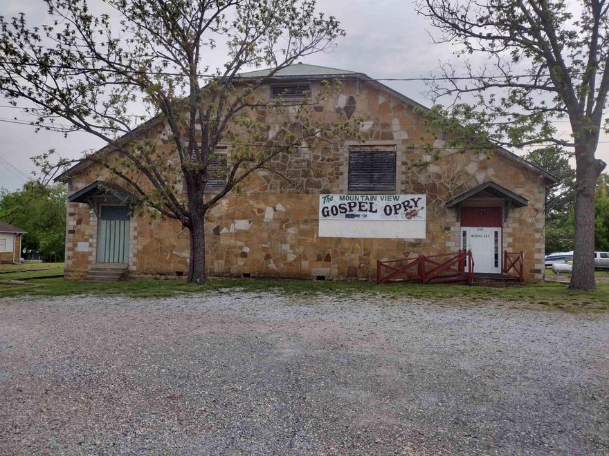 Looking for a large building in town has lots of potential has living quarters in back large stage, could be used for entertainment, auction house, indoor storage, just has endless possibilities.