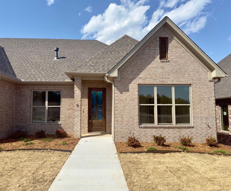 Welcome to Edgewood, West Little Rock’s newest sought-after neighborhood where luxury meets convenience – say goodbye to lawn care, as it’s all included when you purchase a home in Edgewood! Built by Graham Smith Construction and set for completion in May 2025, this beautiful 3-bedroom, 2-bath attached home offers modern, open-concept living with high-end finishes throughout. Step into a bright, open living area featuring a fireplace and designer touches, leading to a gourmet kitchen with stainless steel appliances, quartz countertops, a chic tile backsplash, and custom cabinetry. The primary suite is a true retreat, complete with a shower, vanity, and a large walk-in closet. Luxury Vinyl plank floors flow throughout, adding to the upscale ambiance, while a private patio invites you to relax outdoors. A 2-car garage provides ample parking and storage. Located just minutes from major Little Rock thoroughfares, this home offers easy access to all of central Arkansas. Don’t miss your chance to invest early as this vibrant neighborhood grows!