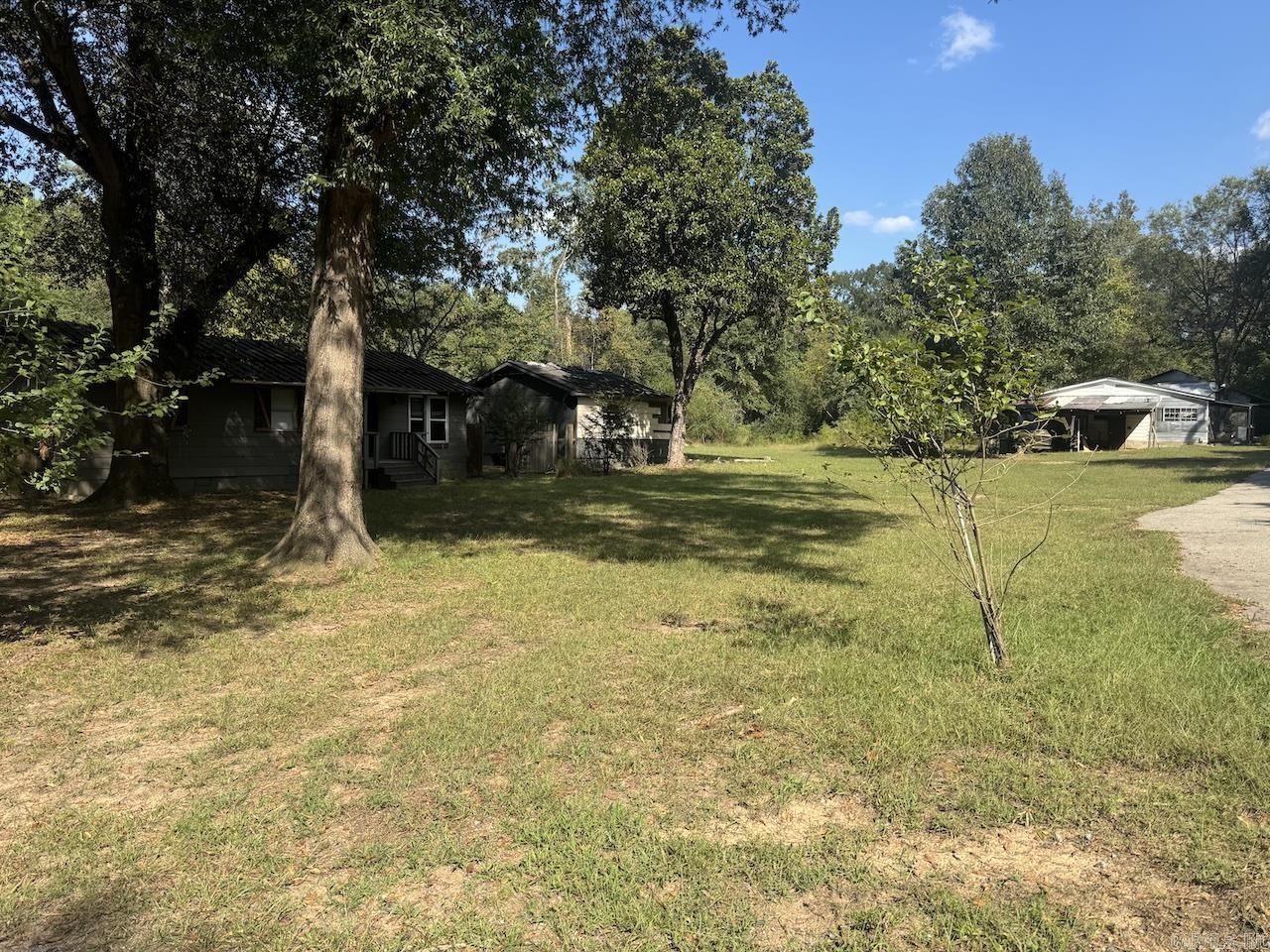 Great Investment Opportunity! This three-bedroom, one-bath home sits on a generous property and comes with two additional parcels with structures on them, offering endless possibilities for expansion, development, or extra outdoor space. The house itself needs updating, making it perfect for investors or buyers looking to put their personal touch on a property. With the right vision, this home and land could be transformed into something truly special. Conveniently located with easy access to town, this is a rare chance to own multiple parcels together.