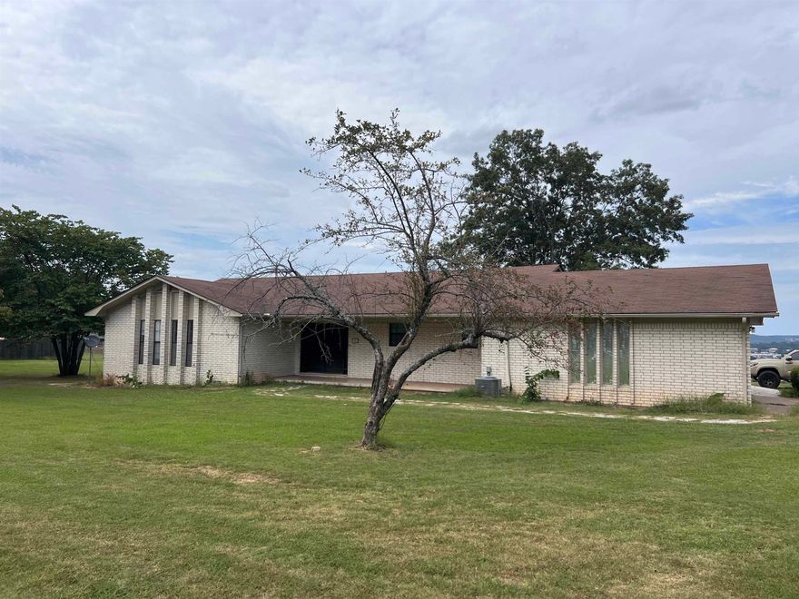 Good bones with a great view. Home needs all new interior doors, flooring, kitchen remodel, roof, and deck.