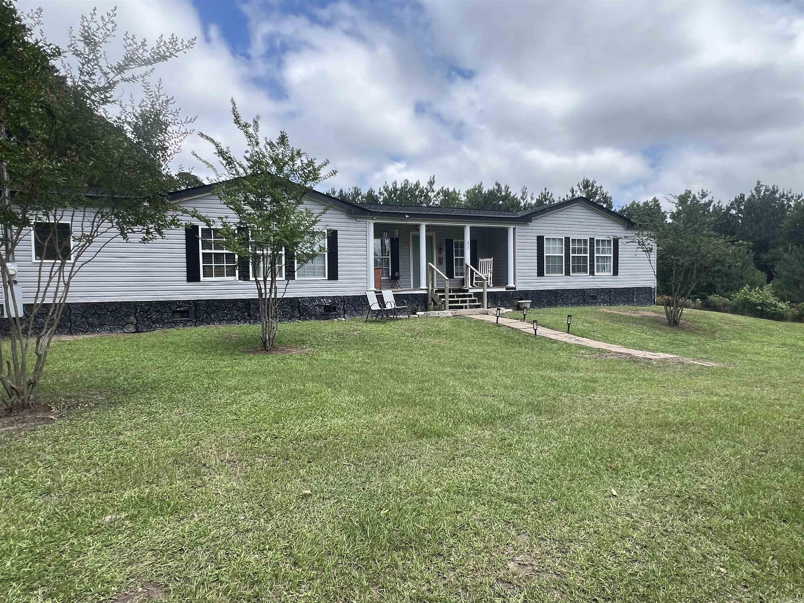 Check out this beautiful 4BR, 2BA home located just outside the city limits of El Dorado. Features include an open floorplan, master suite and master bath separate from other bedrooms, separate dining room and spacious front and back yard. This house is perfect for hosting family gatherings or maybe just enjoying a quiet evening on the back deck. All kitchen appliances will remain including the microwave, as well as the washer and dryer. A Goodman AC unit was installed in 2020 and new roof in 2024. SQFT taken from tax records - see floor plan in documents for actual sqft.