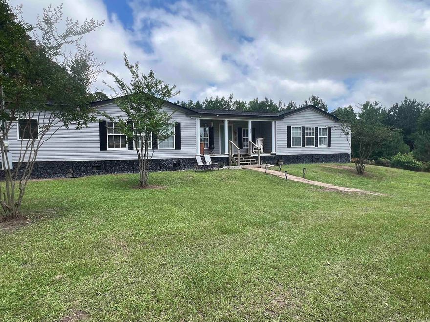 Check out this beautiful 4BR, 2BA home located just outside the city limits of El Dorado.  Features include an open floorplan, master suite and master bath separate from other bedrooms, separate dining room and spacious front and back yard.  This house is perfect for hosting family gatherings or maybe just enjoying a quiet evening on the back deck.  All kitchen appliances will remain including the microwave, as well as the washer and dryer.  A Goodman AC unit was installed in 2020 and new roof in 2024.  SQFT taken from tax records - see floor plan in documents for actual sqft.