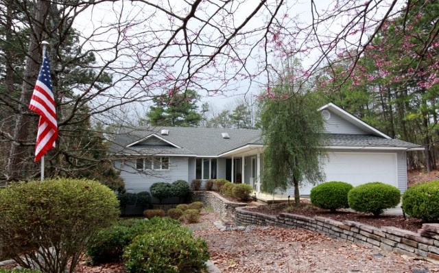 Charming contemporary home with a seasonal view offers more than just a great price! It includes additional Lot 20; every room has volume ceilings; LR, DR, FmRm & Kit have indirect lighting above the architectural ledges; skylights; ceiling fans; MB has a tub/shower combo & Bath 2 has W-I shower; 2 100 lb. propane tanks; stacked stone retaining walls & planters. No disclosure available