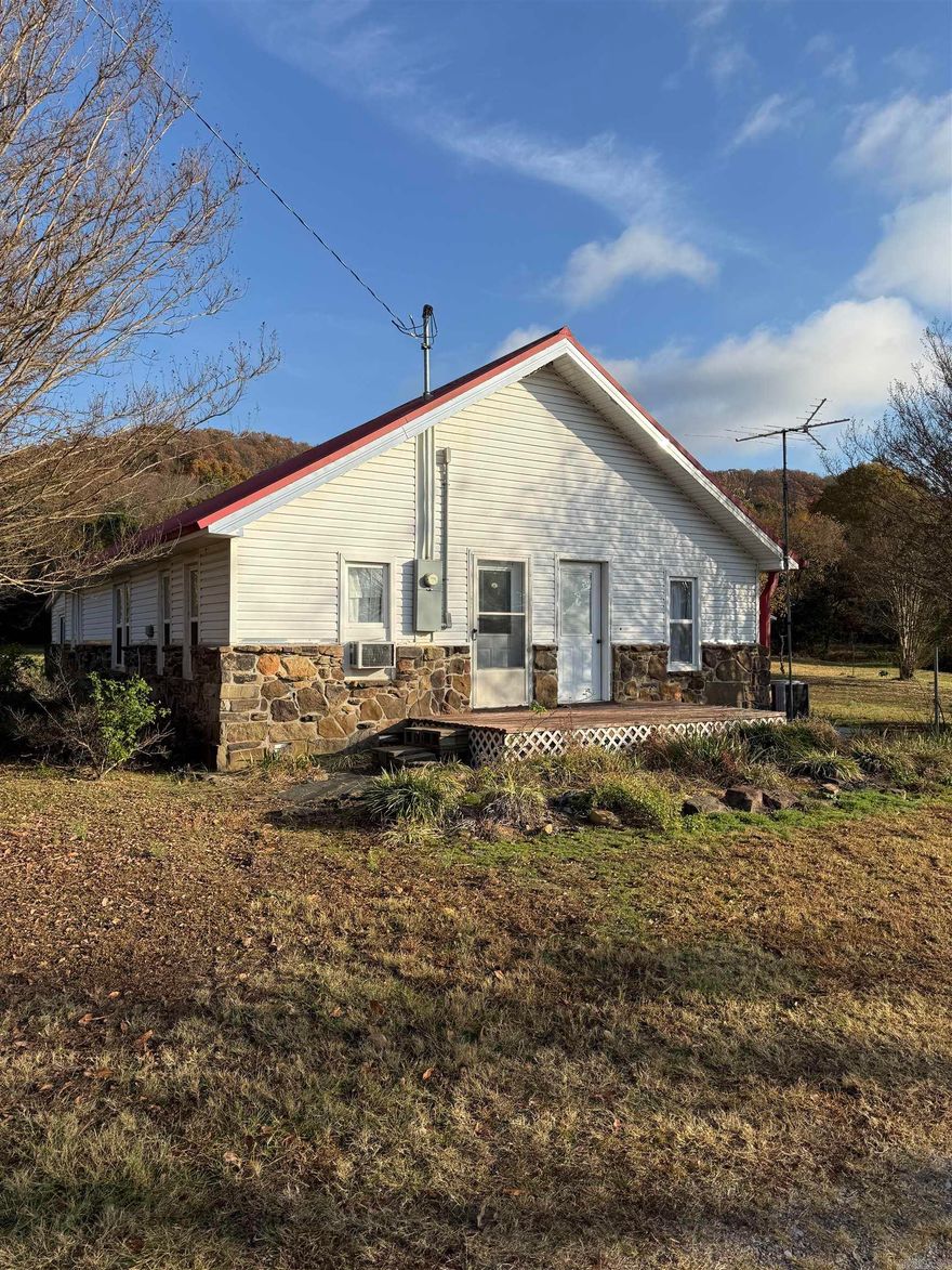 If you are looking for an "End of the road" charming country home on 17 acres in Quitman, look no further! This updated and well maintained home offers 3 bedrooms and 1 large bath. Bath contains tub/shower combo and a newer walk in shower.  New flooring in front part of home, newly renovated kitchen with plenty of storage, newer windows, and central heat and air. Window units are for added comfort. Outside features a metal roof, a large carport and two small buildings. The land is stunning with a great mix of woods and clearings and a nice pond. Check it out before it's gone!