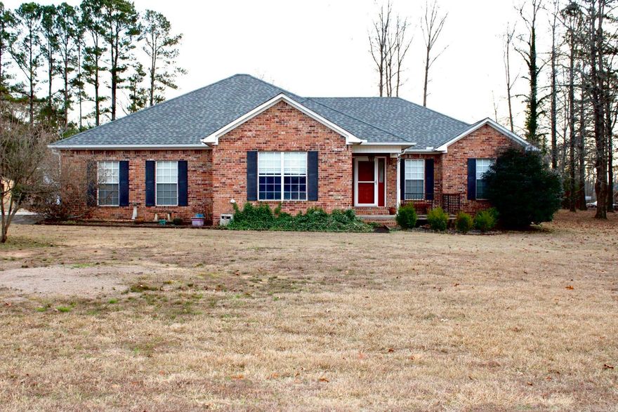 All-brick 2300sf, 3BR/2BA home on 2 acres in Cabot! This well-maintained property features a spacious kitchen with a moveable island, slide-out cabinet bins, and a stainless side-by-side refrigerator that conveys. The large primary suite offers walk-in closets and a beautiful en-suite bath.  Enjoy outdoor living on the large patio and charming front porch, surrounded by mature trees and attractive landscaping. A major bonus is the fully electric shop with concrete floors, full workbench, and bay door for vehicle access—perfect for hobbies, storage, or projects.  Peaceful setting with room to spread out, yet convenient to Cabot amenities.